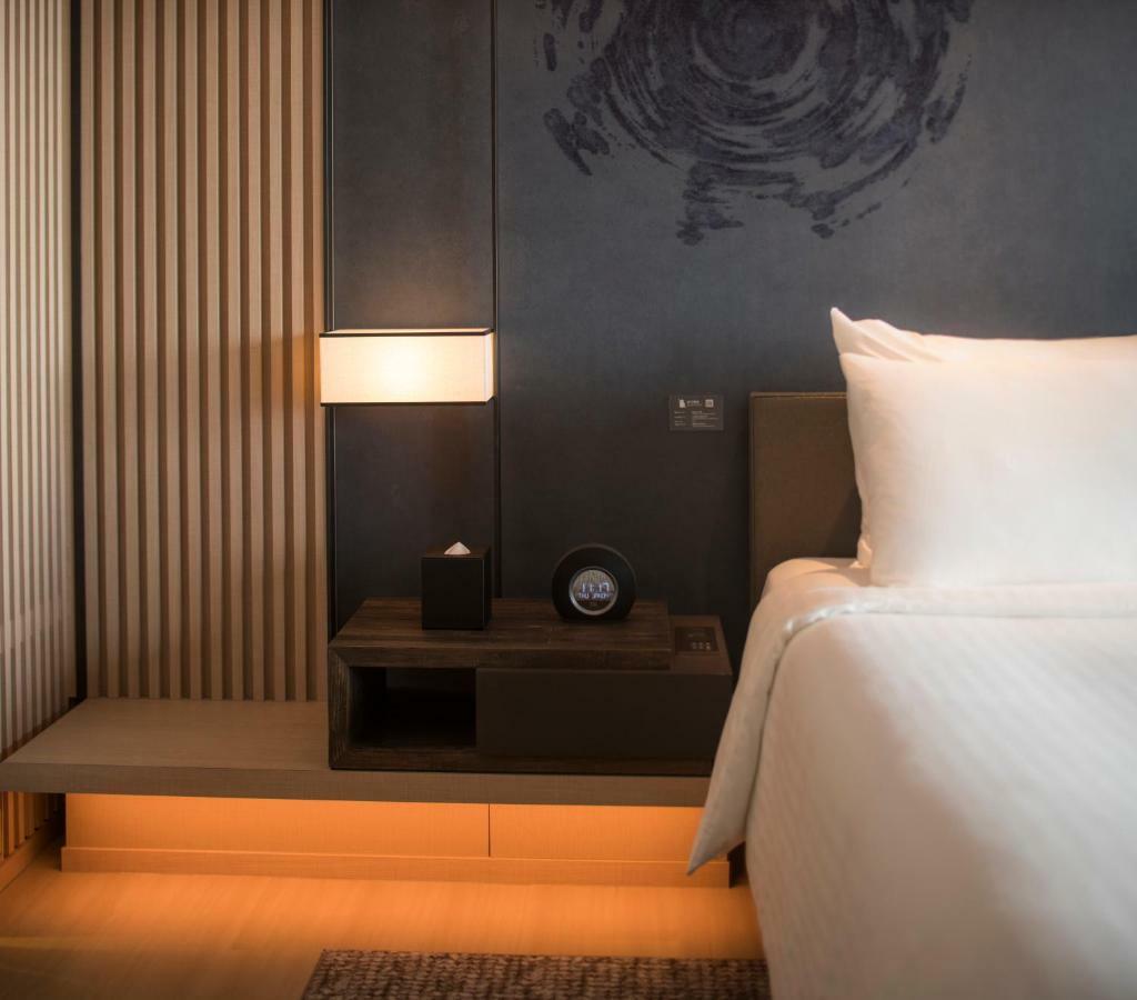 Mu Jiaoxi Hotel Exteriér fotografie A room at the hotel