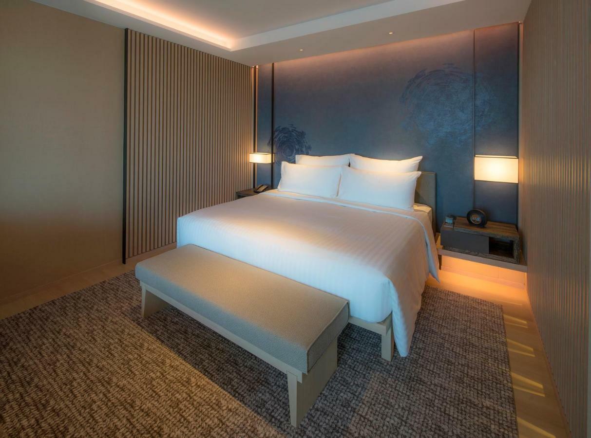 Mu Jiaoxi Hotel Exteriér fotografie A bedroom at the hotel